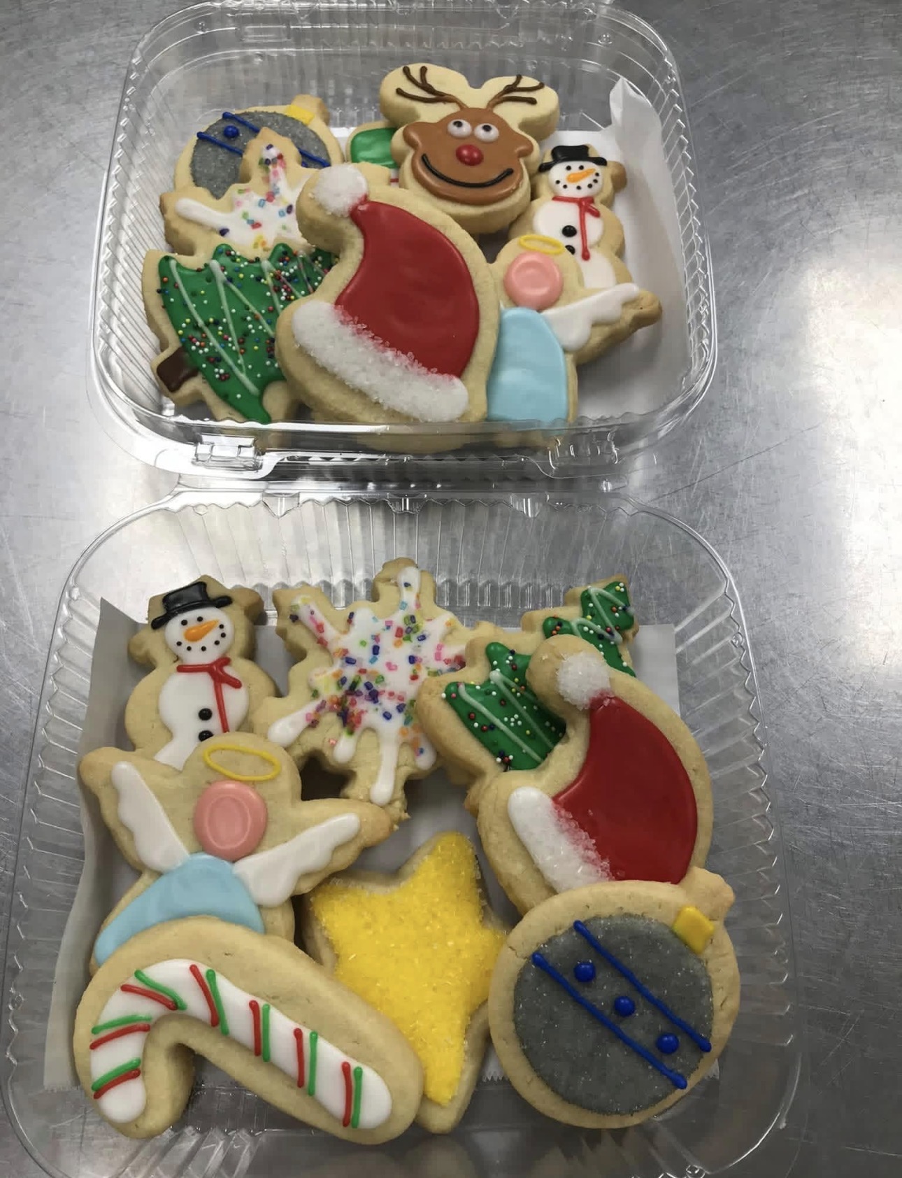 Christmas sugar cookie trays with reindeer, snowmen, angels, trees, santa hats and ornaments